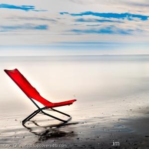 Lonely-Chair-At-The-Beach-Display-Picture