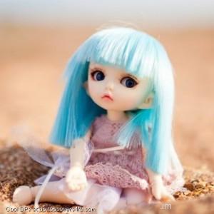 Blue-Hair-Doll-Sitting-At-Sand-Display-Picture