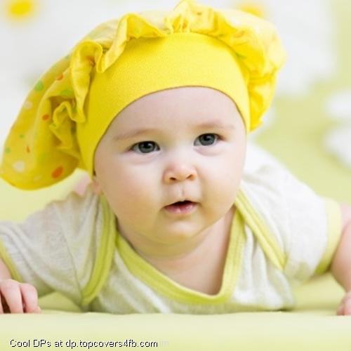 Baby-Lying-On-Green-Display-Picture